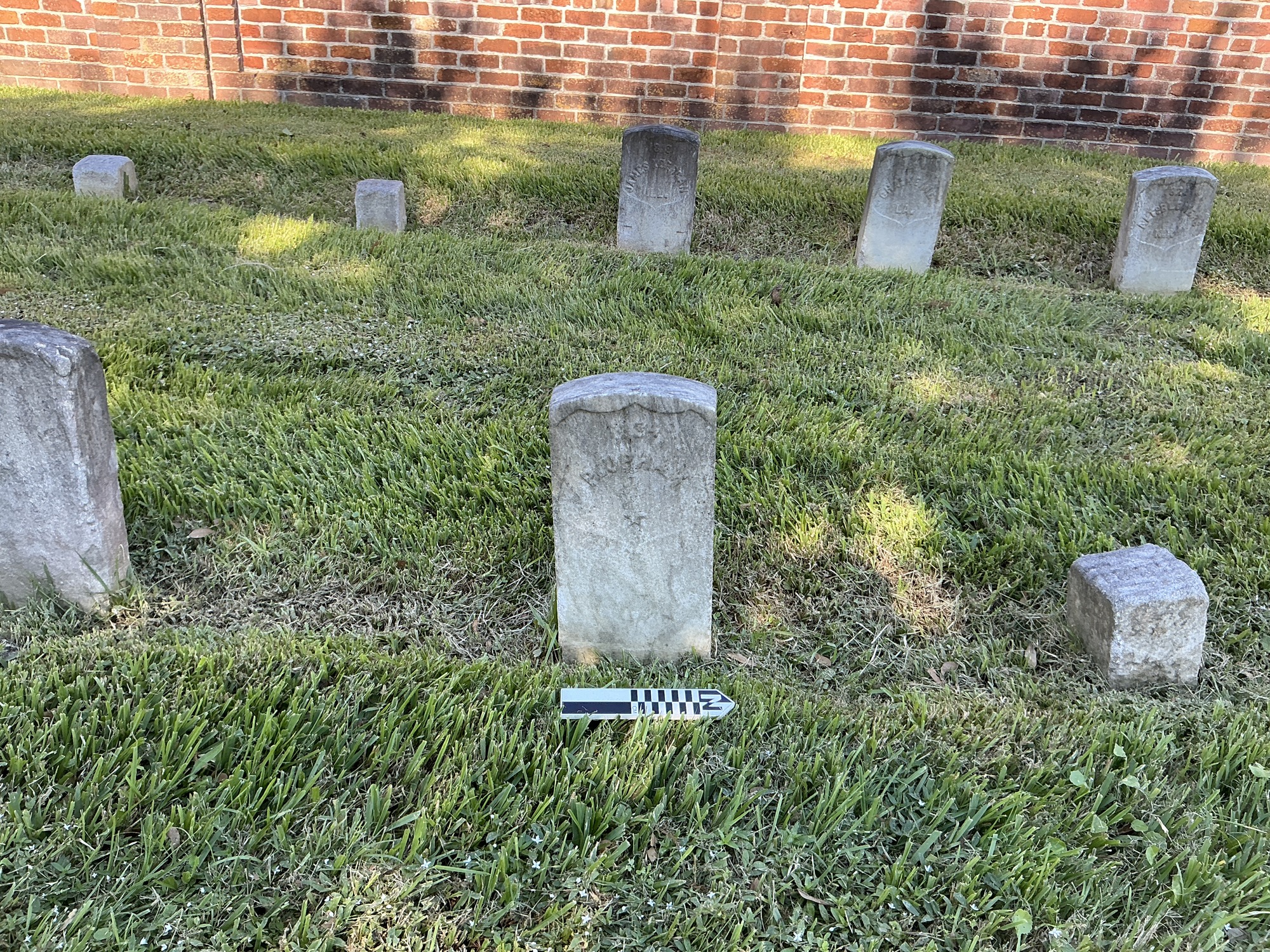 Extra image of historic upright marble headstone with recessed shield face.