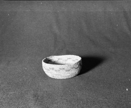 Marie Rozier Collection, Catalog No. 75. Object: Miwok basket. Dimensions: 6 x 2 1/2". Materials: Bull pine and fern root. Technology: Single rod, fag ends trimmed on work face, moving ends clipped on interior or bound under. Collection History: Made for Mrs. Ida Hallen about 1915 by a local Native American woman. Gift of Florence Whitcomb. Photographed by Michael Dixon in December 1982. Catalogued by Craig Bates and Barbara Beroza. Yosemite Collections, National Park Service.