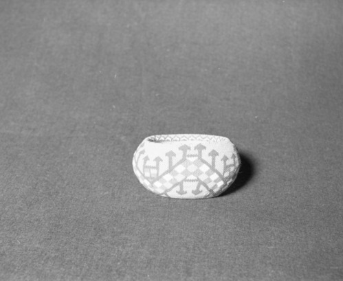 Mrs. Donald Segerstrom Collection. Object: Paiute beaded basket. Dimensions: 4 3/4 x 2 1/4". Materials: split willow, glass beads. Technology: single rod non-interlocking stitch, beaded with single bead brick stitch using monofilament thread. Collection History: purchased from Carrie Bethel by Donald Segerstrom ca. 1960. Photographed by Michael Dixon, January 1983. Catalogued by Craig Bates and Barbara Beroza. Yosemite Collections, National Park Service.