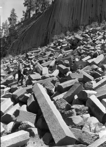 Closeup of talus of broken posts with Ranger Jacobs.