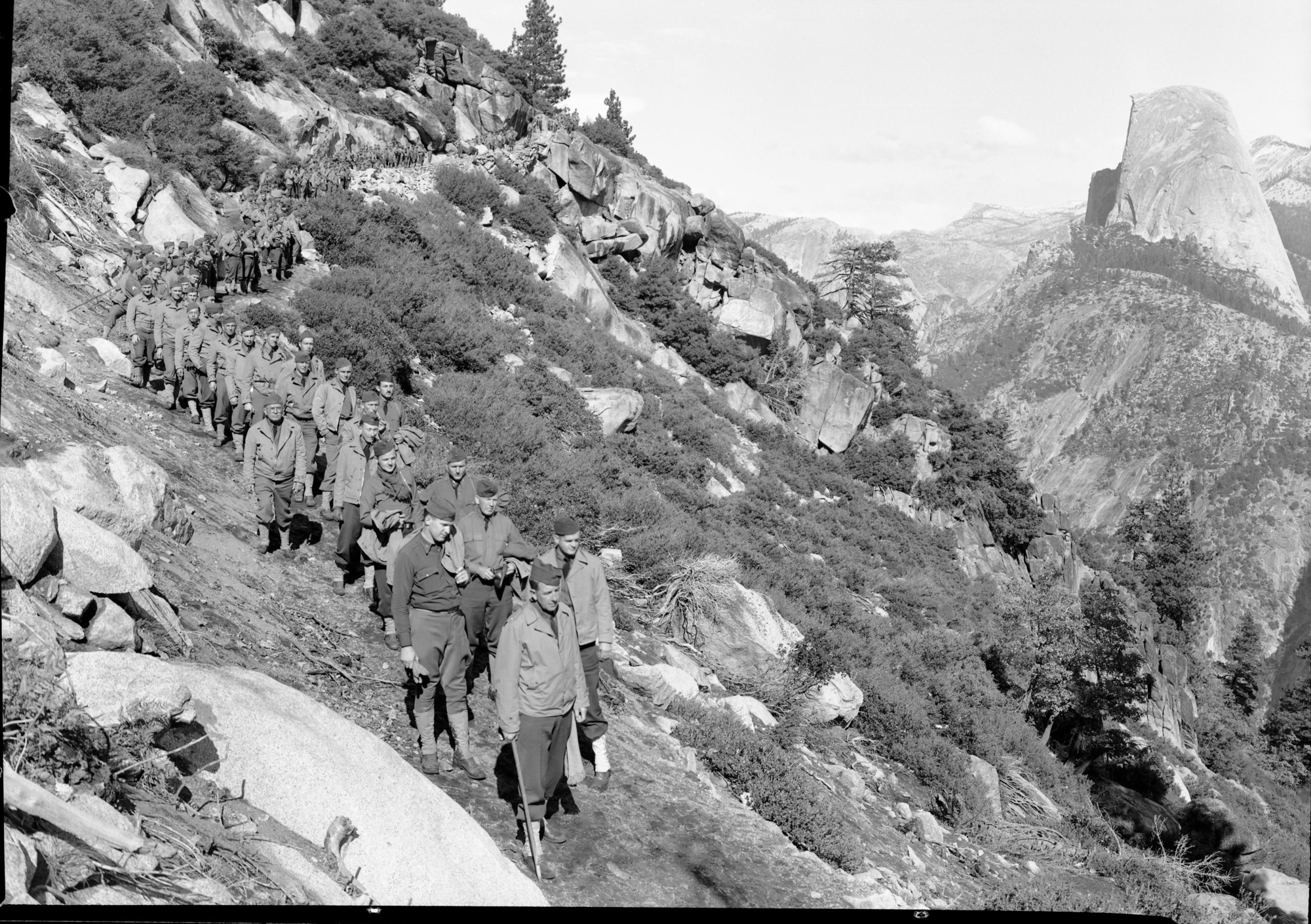 Hiking Soldiers of 30th Field Artillery from Camp Roberts headed by Col. Ray W. Barker on 11 mile trail.