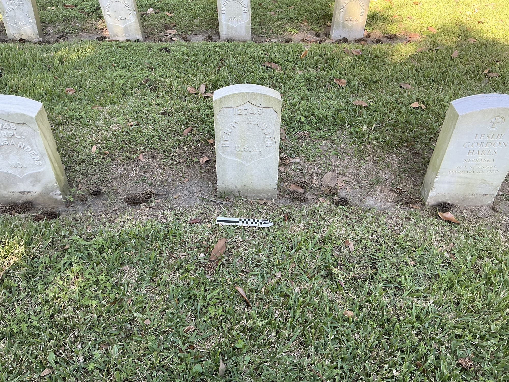 Extra image of historic upright marble headstone with recessed shield face.