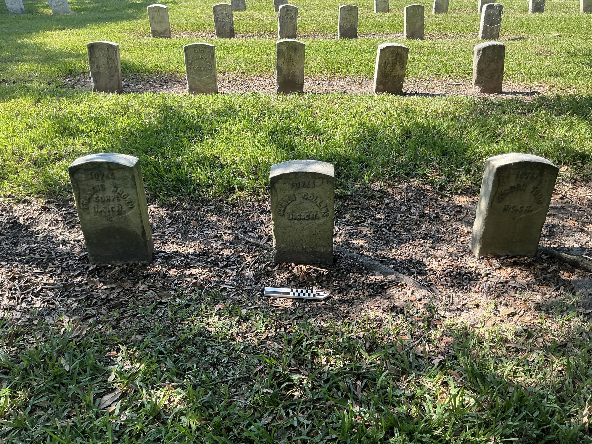 Extra image of historic upright marble headstone with recessed shield face.