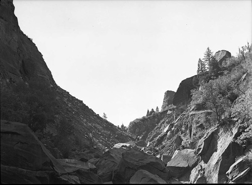 Landslide (breached dam) shows typical rubble and stream cut in landslide dam.