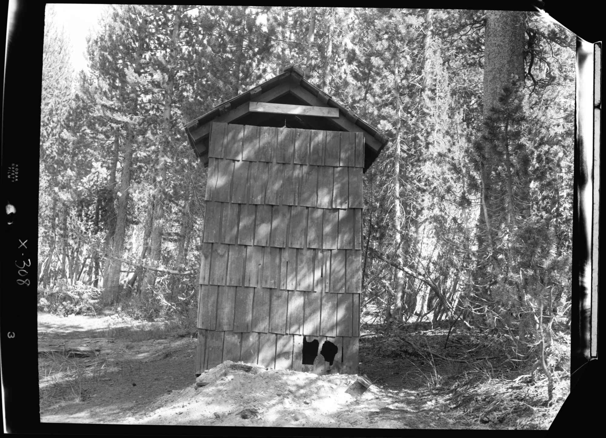 Typical wooden privy in the Tenaya Lake campground of Yosemite showing rundown condition and porcupine holes. Over 40 of these structures still exist for public use on the floor of Yosemite Valley.