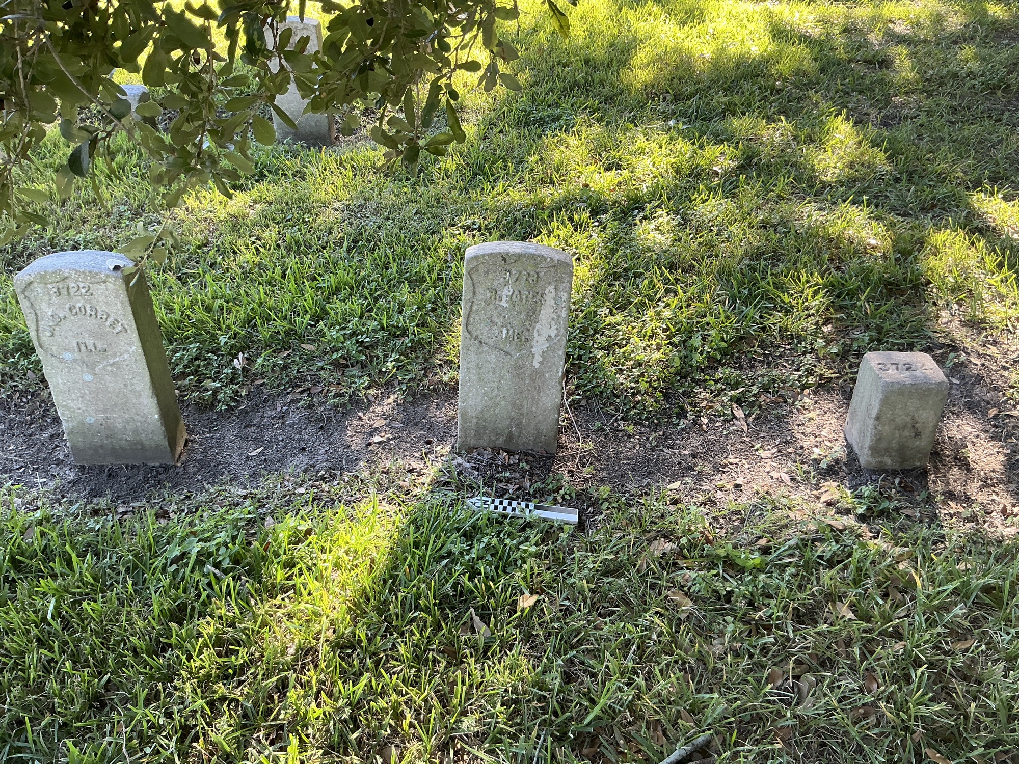 Extra image of historic upright marble headstone with recessed shield face.