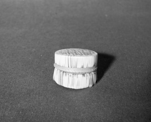 Marie Rozier Collection, Catalog No. 155. Object: Micmac porcupine quill basket. Dimensions: 3-1/8 x 2-1/8". Materials: Birchbark; sweetgrass, thread, porcupine quills. Collection History: Purchased in Vermont by Mary Long. Photographed by Michael Dixon in December 1982. Catalogued by Craig Bates and Barbara Beroza. Yosemite Collections, National Park Service.