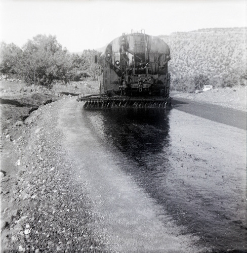 View from behind of construction vehicle during chipsealing of Kolob Canyon Road.