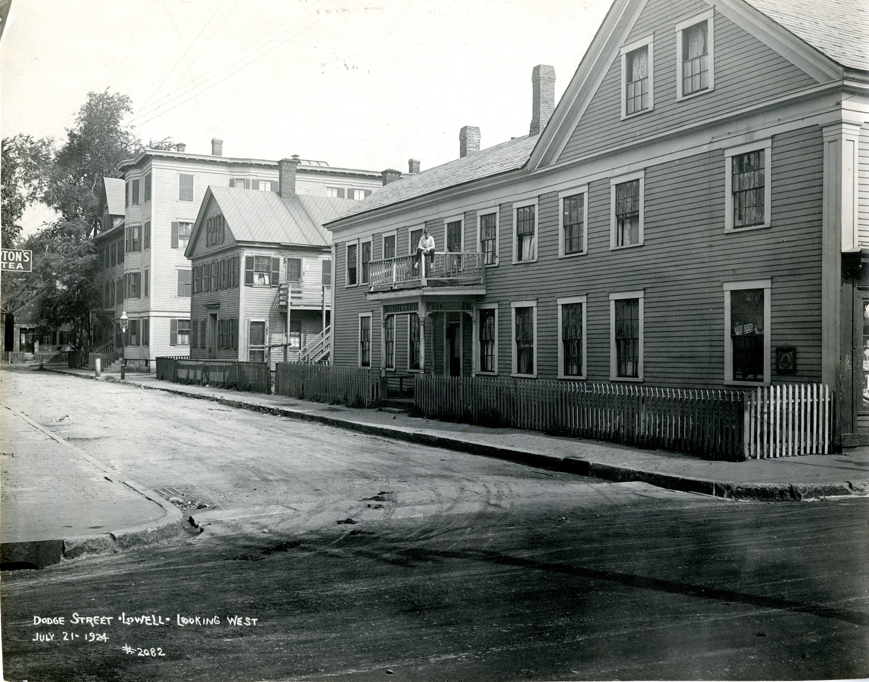 A photo showing a boy on a railing