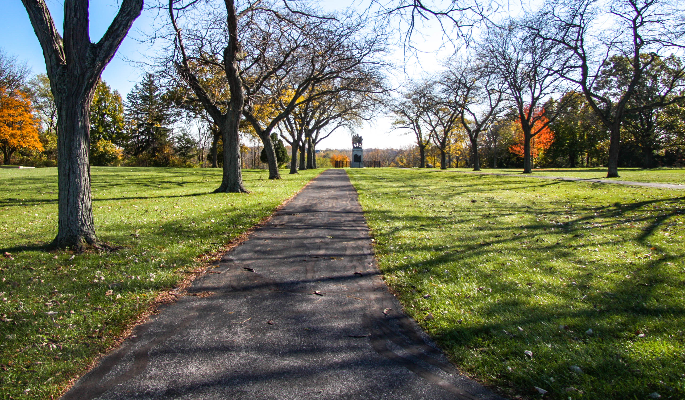 Pathway leading to a statue in the distance