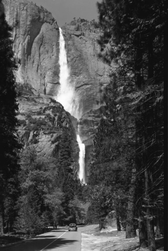 Yosemite Fall with can on the road.