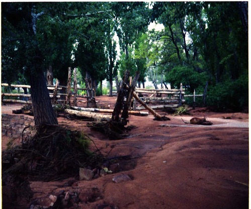 Color photo of flood damage at Pipe Spring National Monument.