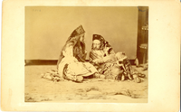 Miss Agnes Bates and General George Armstrong Custer in the Costumes of a Sioux Chief and His Bride Reclining. LIBI_00019_00291; This item is an original albumen photograph of George A. Custer and Agnes Bates reclining on the floor in costume.  The photograph is 4 1/4 x 5 1/2