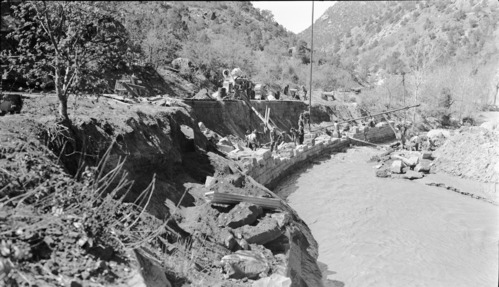Flood damage of debris washed on to park road.
