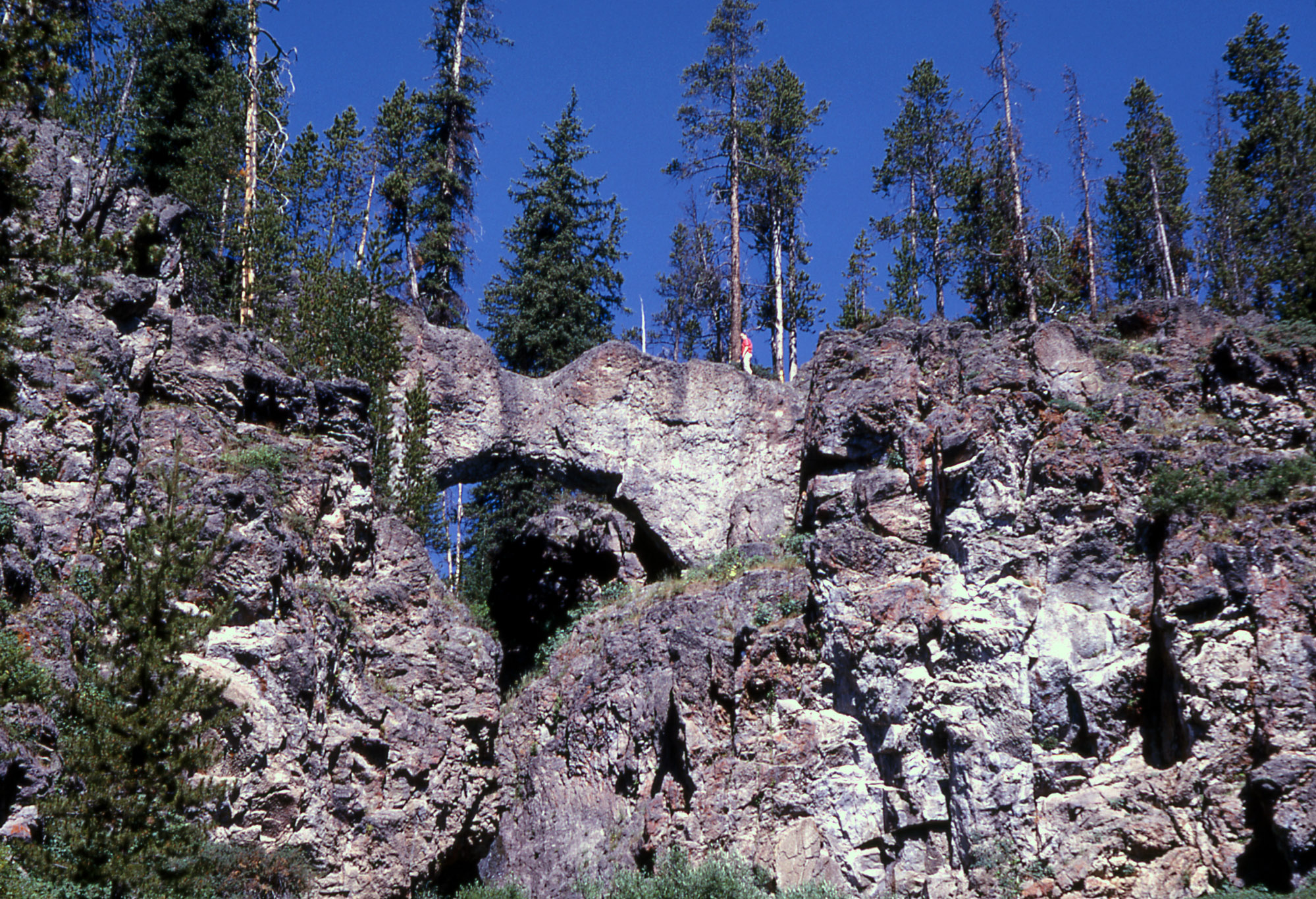 Person standing on top of the natural bridge