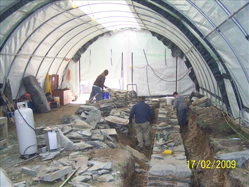 HPTC Day Labor Craftsmen laying stonework for the HAFE Park west arsenal foundation stabilization, Harpers Ferry Lower Town, February 17, 2009.