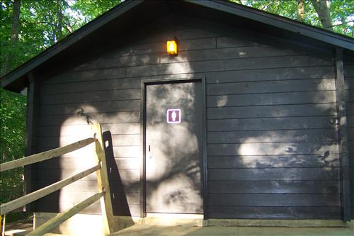 Paint and stain exterior of historic structures in camp 3 and camp 5 at Prince William Forest Park in June 2012.