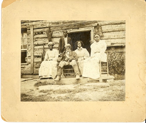 African American Family in Front of a Log Cabin