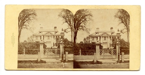 Black and white sterograph of facade of Gorgian mansion.