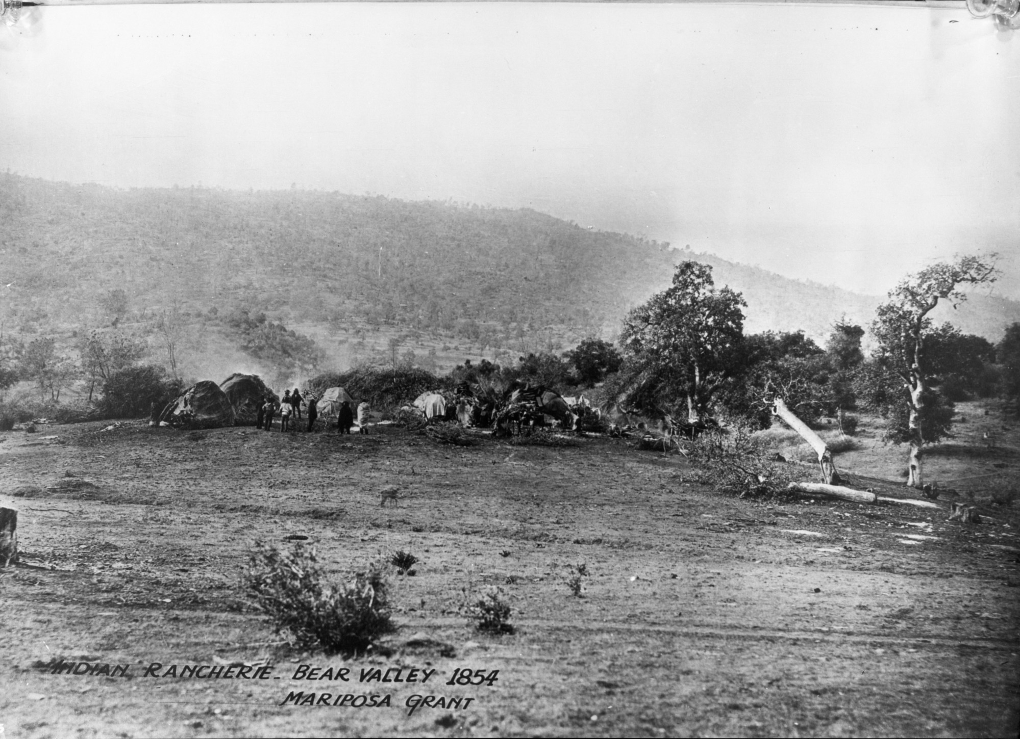 Native American Rancheria Bear Valley 1854 Mariposa; Note on old negative envelope: Watkins 1861 (Camera not on west coast in 1854). [According to Palmquist's biography of Watkins, Watkins series of views of John Fremont's estate were in 1860 + at Bear Valley. Most likely this view was taken at that time. C Bates 7/2/85]