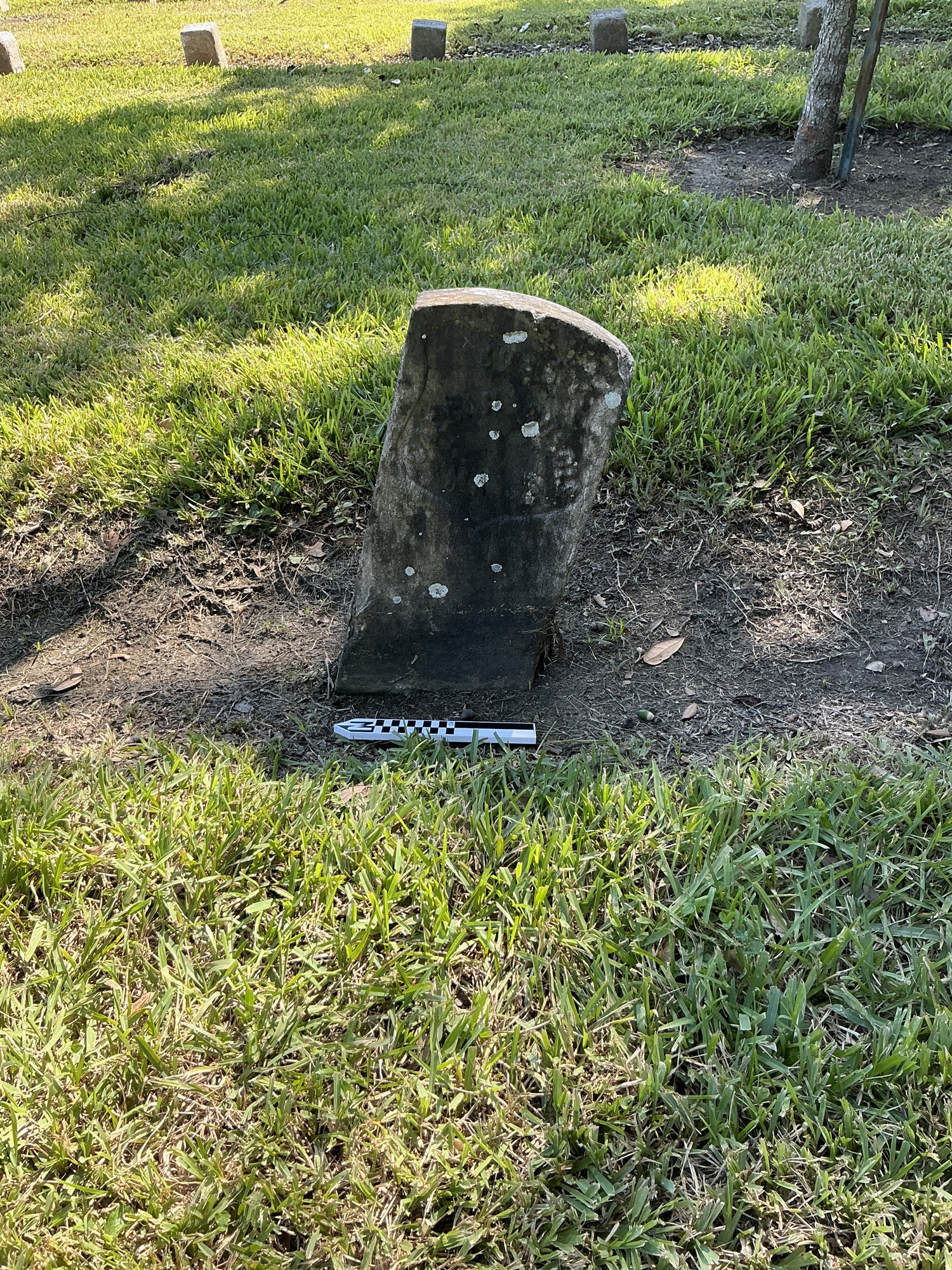 Extra image of historic upright marble headstone with recessed shield face.