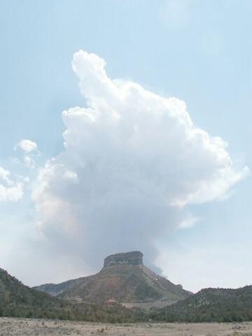News media and park staff observe fire from a parking lot as a white smoke plume rises vertically over Long Mesa, Long Mesa Fire, Mesa Verde National Park, July-August 2002