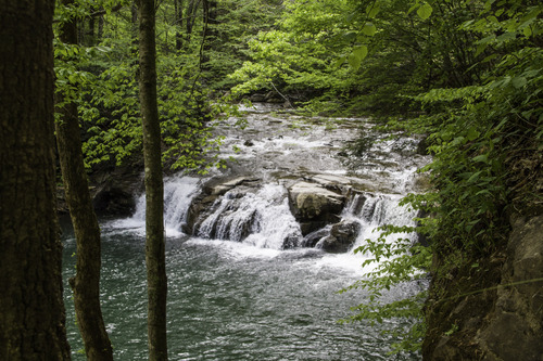 cascading waterfall and deep pool