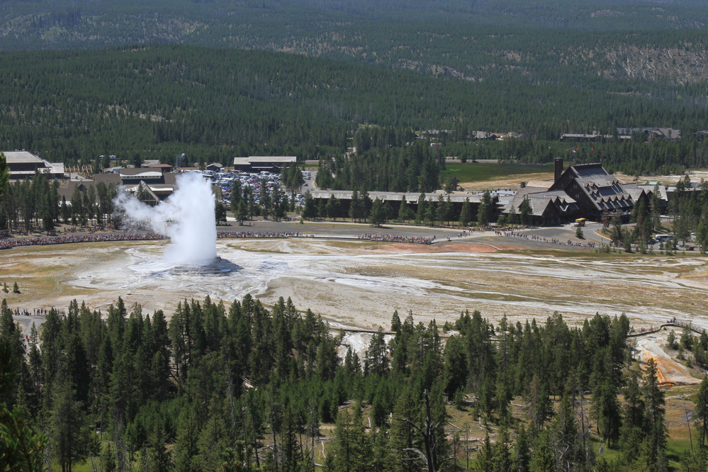 View from high elevation looking down on the eruption and visitors watching it
