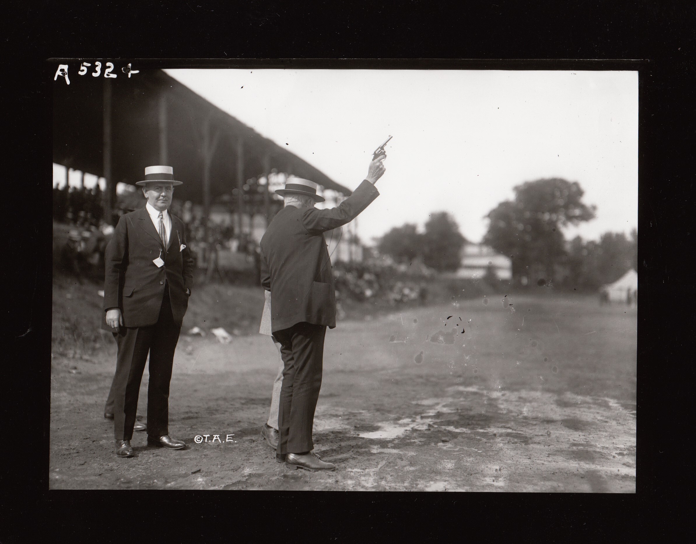 Thomas Edison firing starter's pistol during Edison field day at Olympic park.