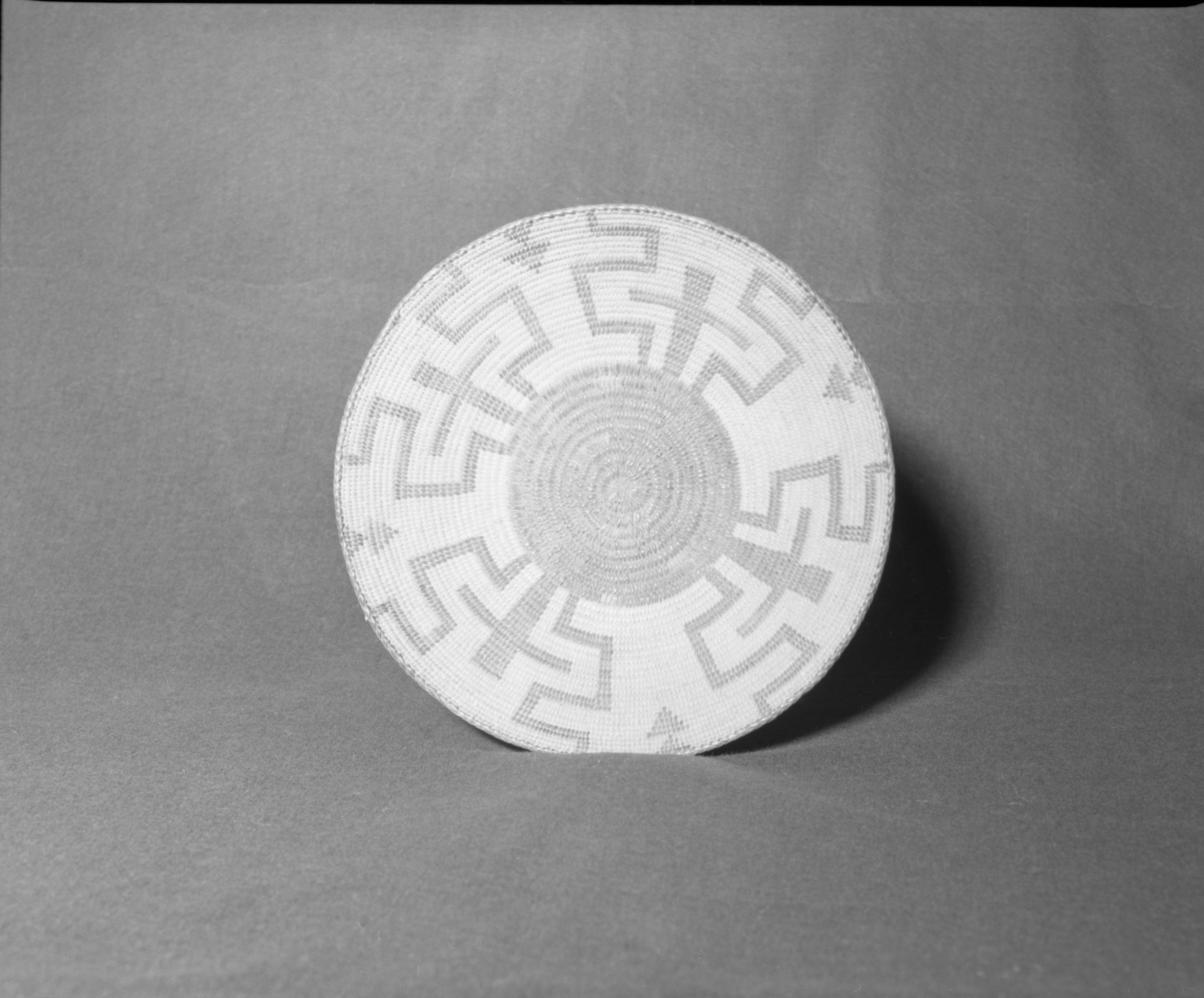 Mrs. Donald Segerstrom Collection. Object: Pima tray. Dimensions: 13 x 3". Materials: willow, cattail runners, devil's claw. Technology: ---. Collection History: ---. Photographed by Michael Dixon, 1/83. Catalogued by Craig Bates and Barbara Beroza. Yosemite Collections, National Park Service.