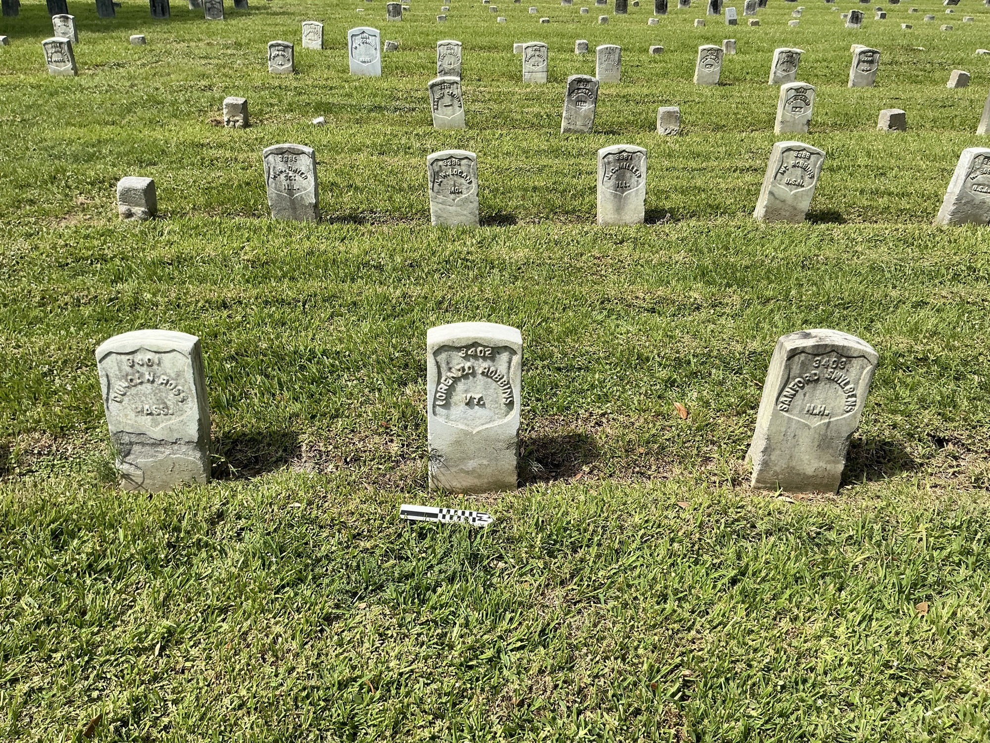 Extra image of historic upright marble headstone with recessed shield face.