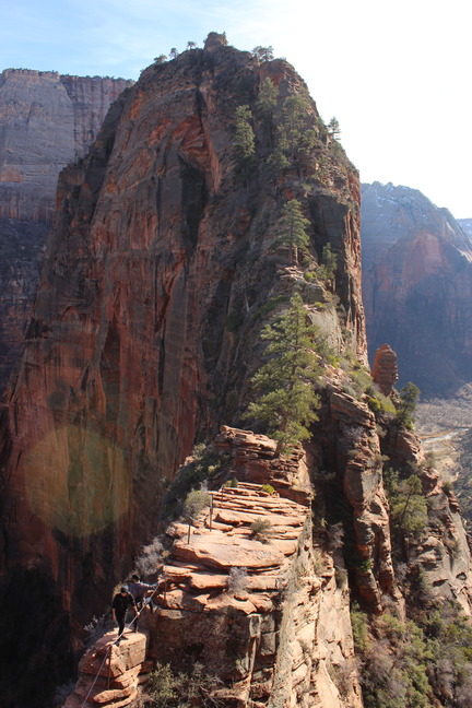 View of a narrow rock ridge leading out to a summit. 