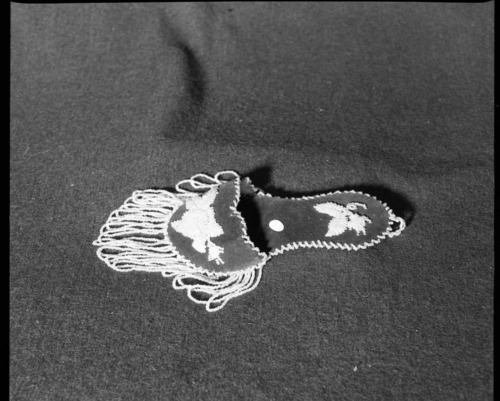 Marie Rozier Collection. Object: Beaded slipper. Dimensions: 9". Materials: velvet, crystal colored glass beads. Collection History: probably produced in Niagara Falls region ca. 1900. Bought in Jamestown in 1978 for $7.50. Photographed by Michael Dixon, December 1982. Catalogued by Craig Bates and Barbara Beroza. Yosemite Collections, National Park Service.