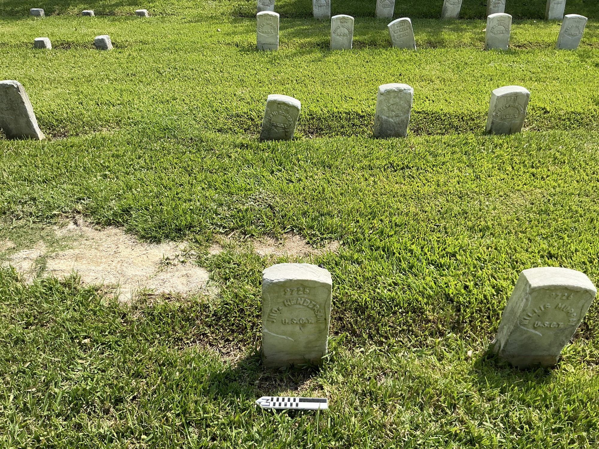 Extra image of historic upright marble headstone with recessed shield with recessed lettering face.