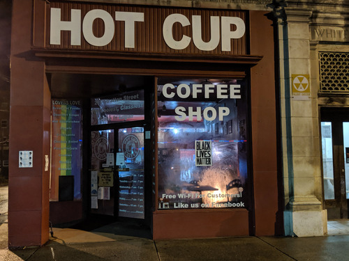 exterior of coffee shop with Black Lives Matter poster