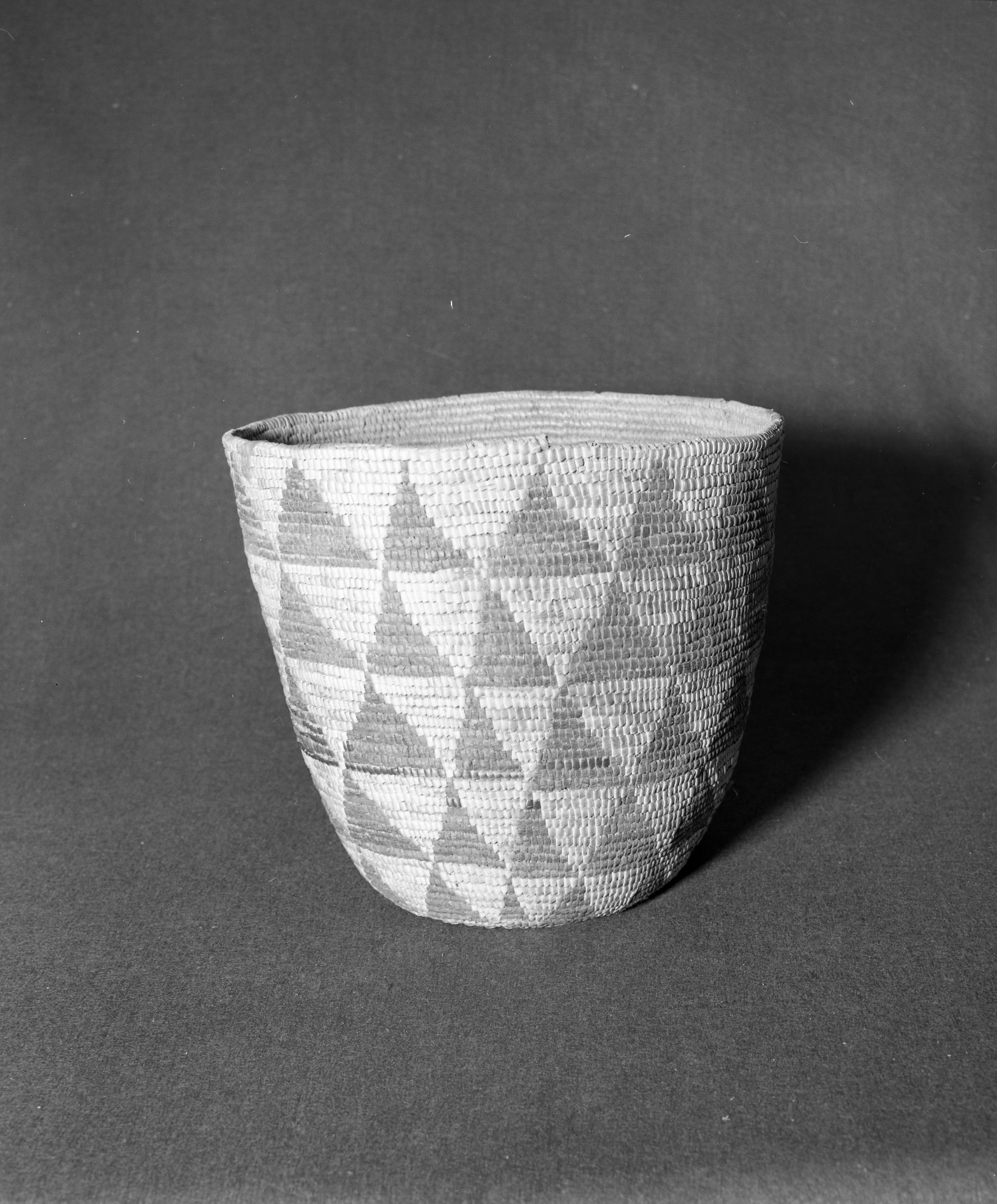 Marie Rozier Collection, Catalog No. 178. Object: Salish basket. Dimensions: 11 1/2 x 12". Materials: Cedar root, beargrass, cherry bark.Technology: Imbricated design, rightward coil direction, oval start. Collection History: Purchased from Berger Roos 1964 for $25. Photographed by Michael Dixon, December 1982. Catalogued by Craig Bates and Barbara Beroza. Yosemite Collections, National Park Service.