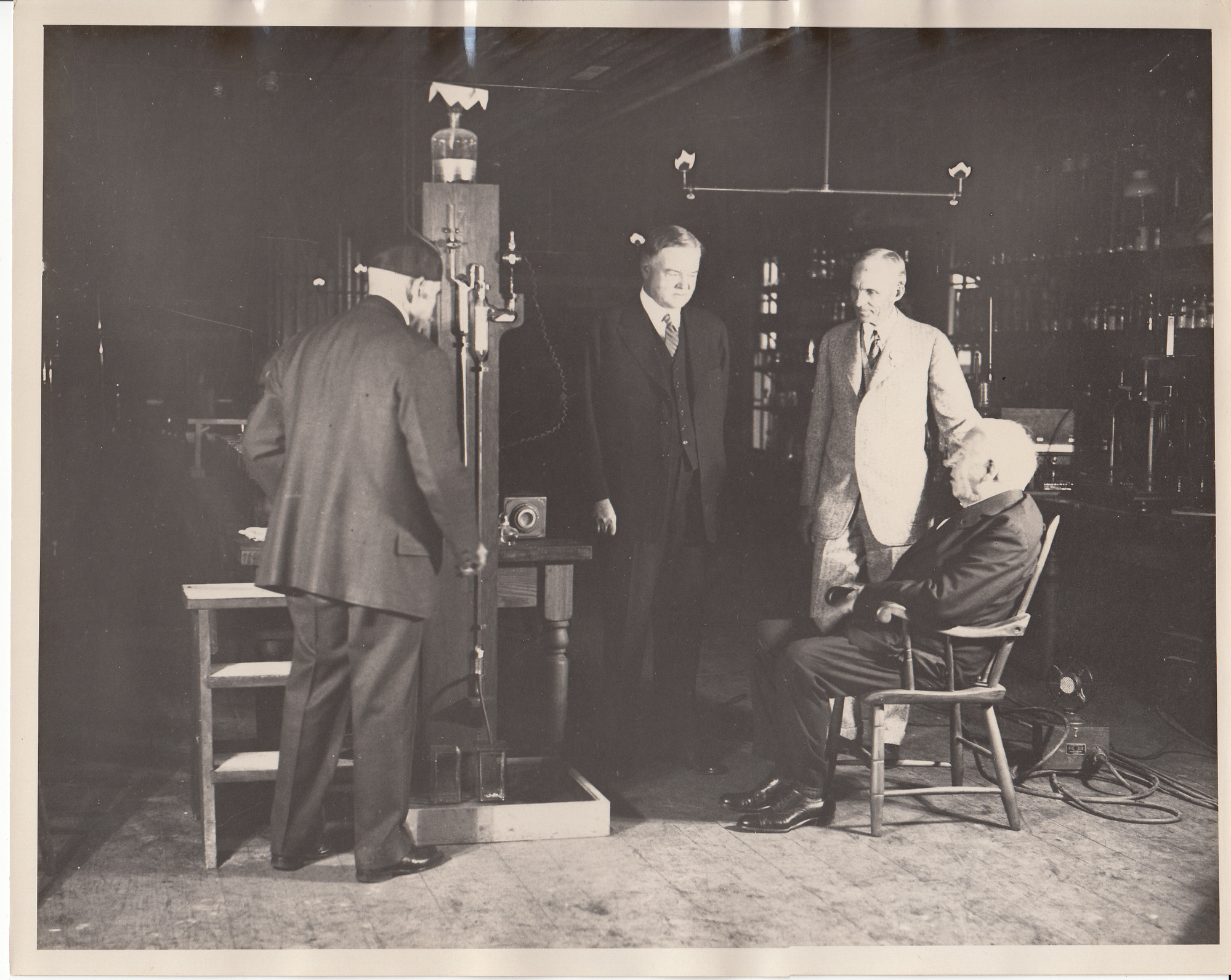 Francis Jehl, President Herbert Hoover, Thomas Edison, and Henry Ford at reconstructed Menlo Park lab.
