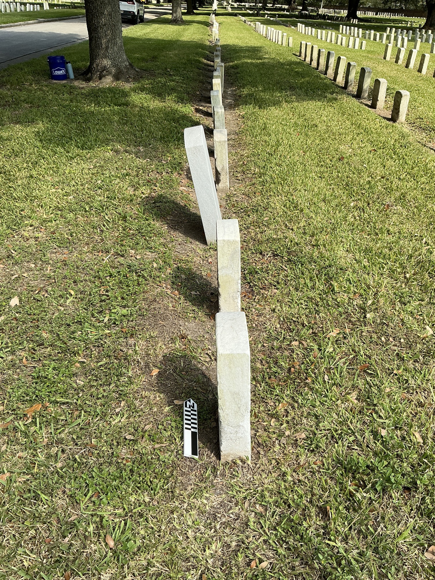 Extra image of historic upright marble headstone with recessed shield face.