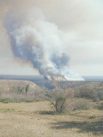 Heavy white and dark smoke in distance views of the Long Mesa Fire at Mesa Verde National Park, July-August 2002