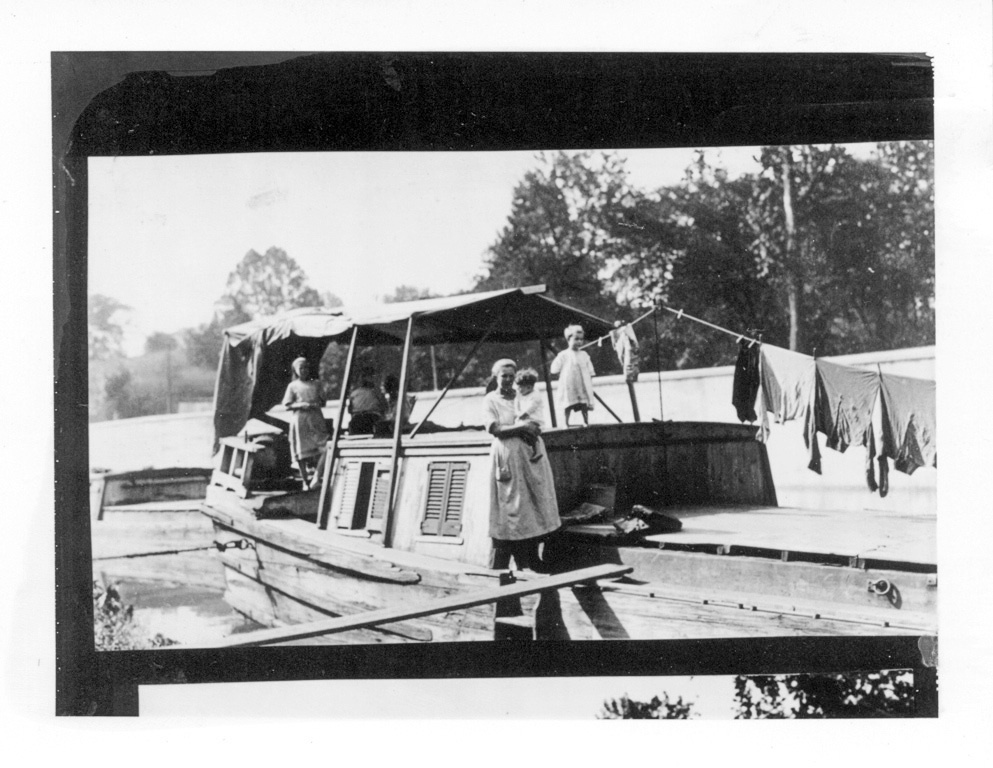 Historic Photo of a Family posing for a photograph on a Canal boat