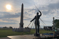 soldier monument strapped to truck for transport 
