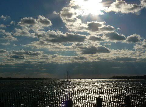 Boat on water looking toward Sandy Hook
