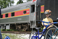Cuyahoga Valley Scenic Railroad, Bikers Waiting to Board Train. In 2007 CVSR and NPS launched Bike Aboard!service to encourage use of the railroad as alternative transportation. For a $2 fare cyclists can ride the train in one direction and bike the other along the Ohio & Erie Canal Towpath Trail. Some images are at Rockside Station and others in Peninsula near the Peninsula Depot.