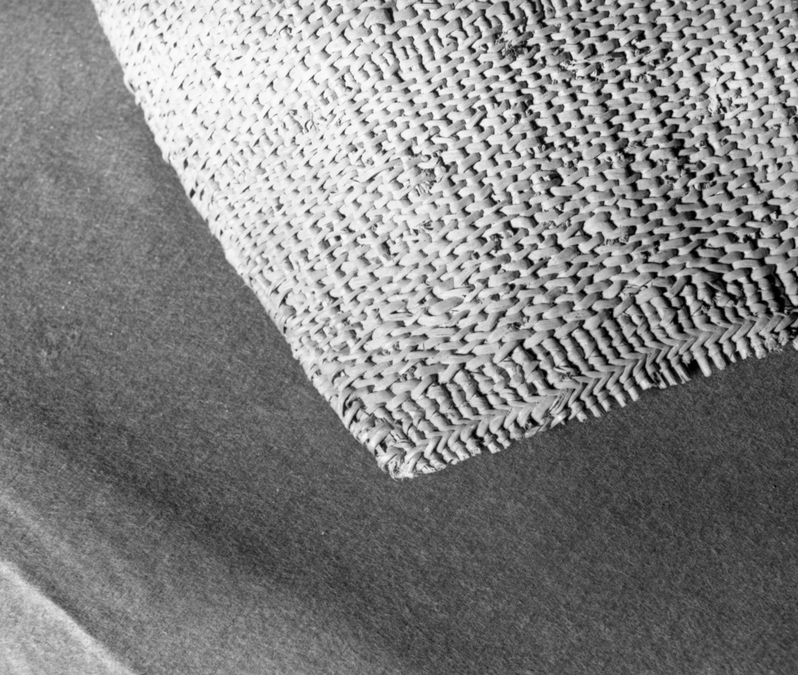 Private Collection. Object: Costanoan basket. Dimensions: 56 x 43 cm. Materials: sedgeroot, equisetum root, unidentified shoots, rimstick unid. (red bark). Technology: starts with one row of plain twining, up to right slant of turns, then row of bound weave, three rows of plain twining with alternate slants of turns, body of basket in diagonal twining, with one row of plain twining 13 cm from start, wrapped and stitched rim finish. Photographed by Michael Dixon. Catalogued by Craig Bates and Barbara Beroza. Yosemite Collections, National Park Service.