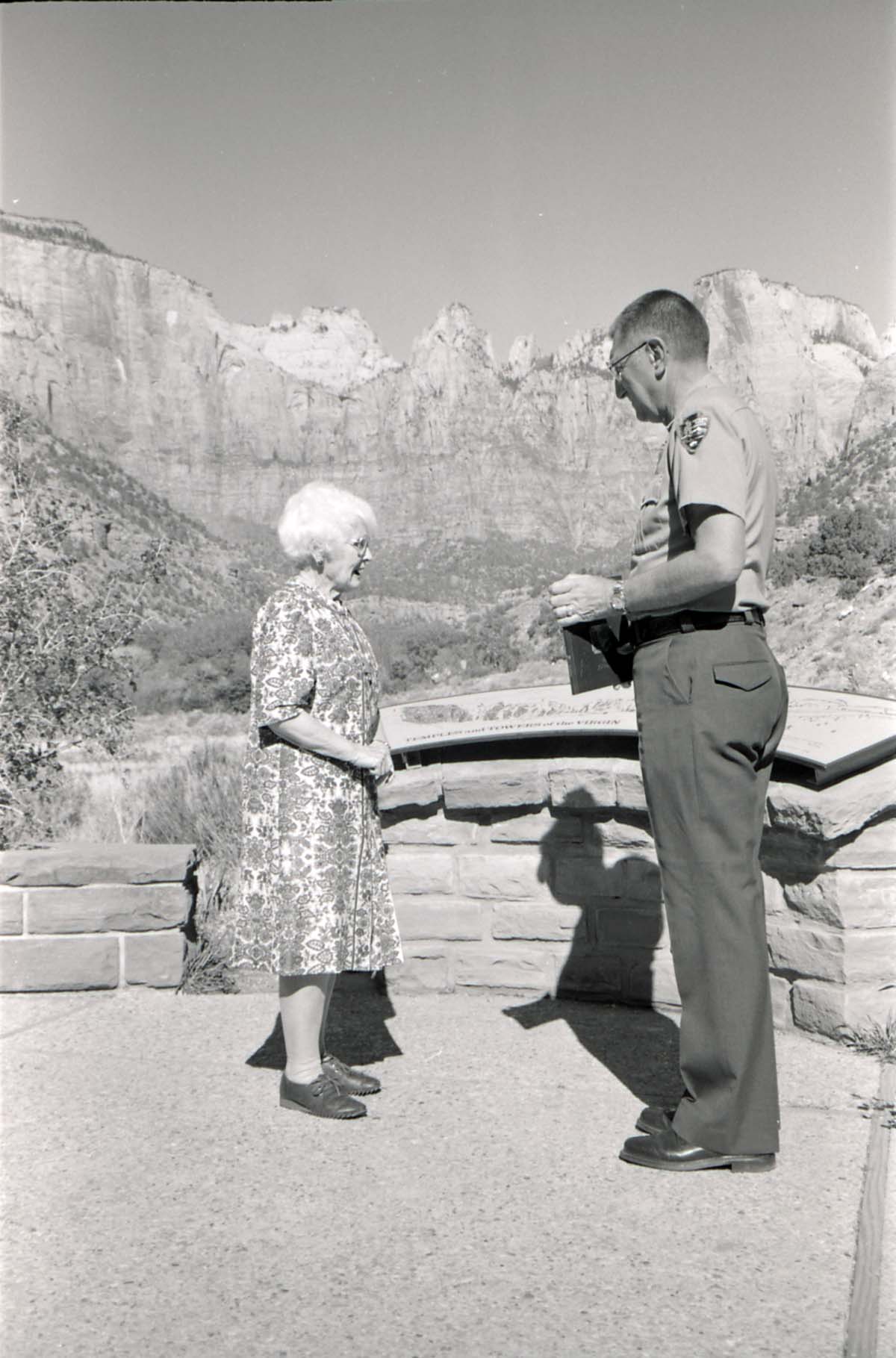 BW Photos of Superintendent Harold Grafe giving award to lady.
