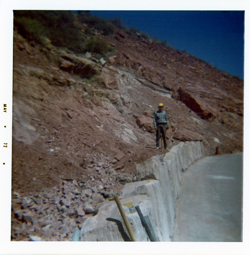 Man helping construct the slide control wall along Kolob Canyon Road.