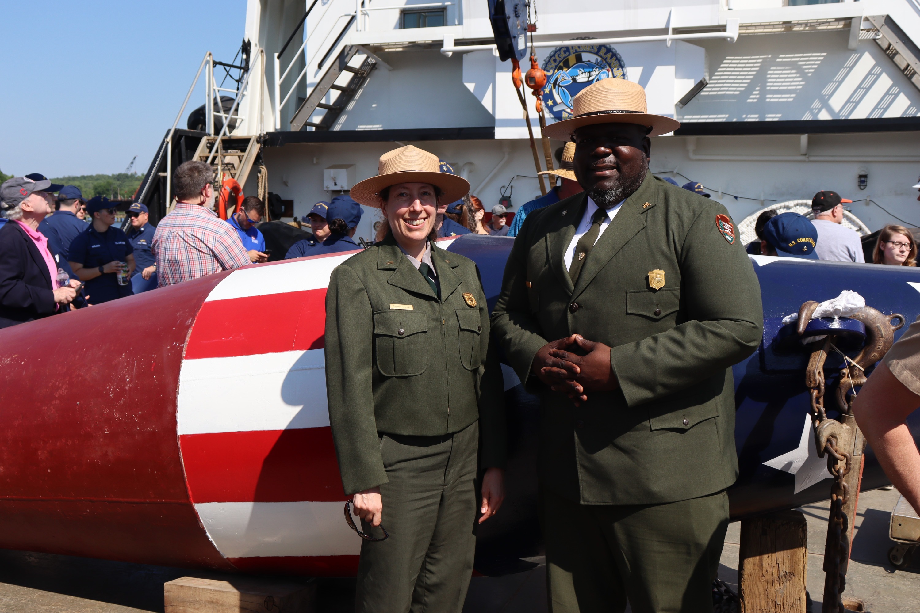 NPS rangers from FOMC pose in front of memorial buoy.