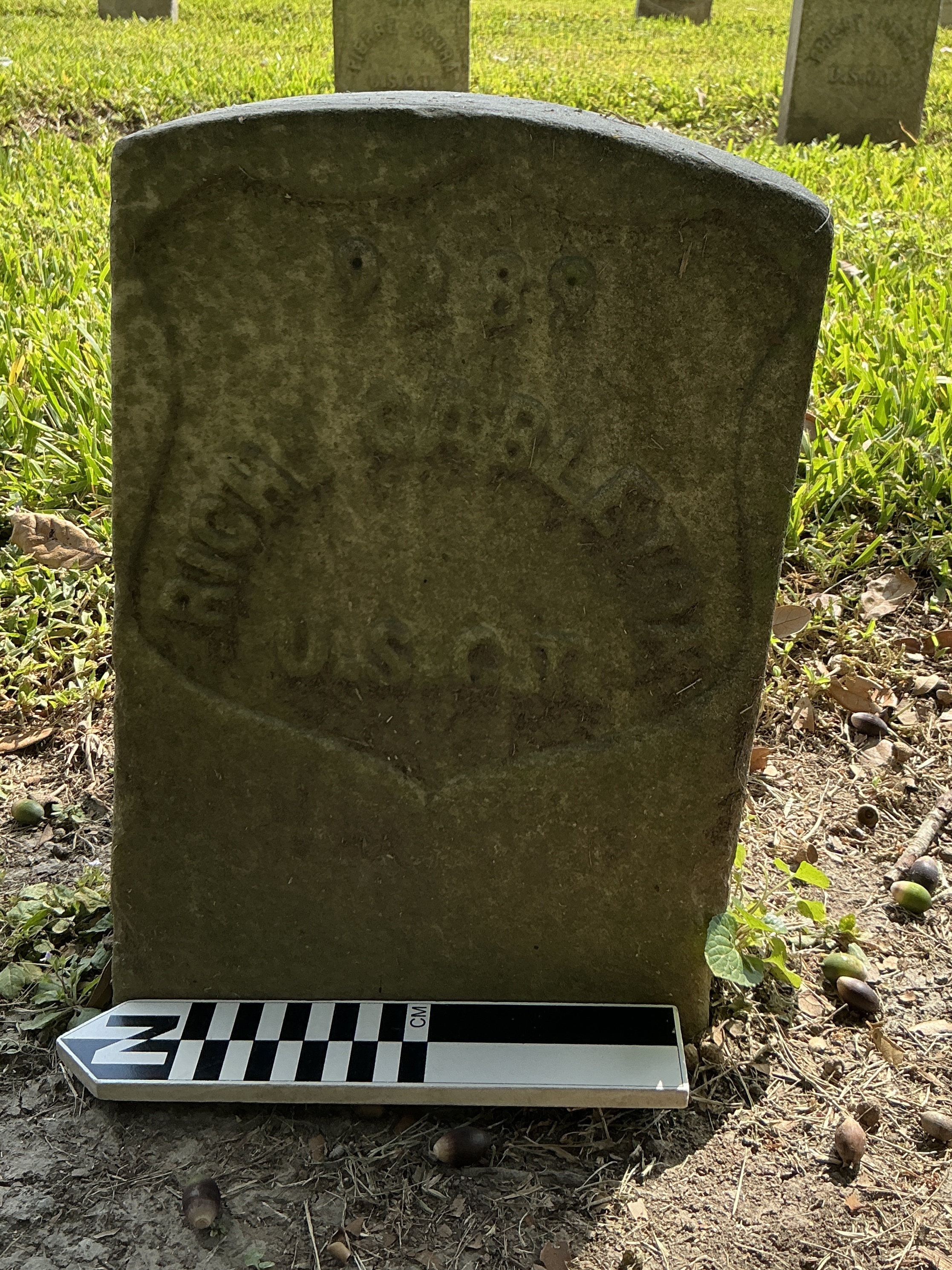 Extra image of historic upright marble headstone with recessed shield face.