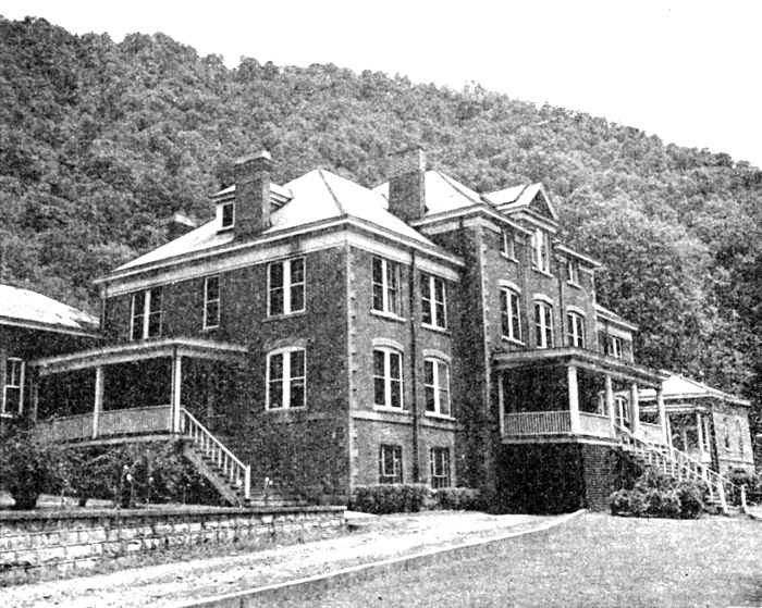 black and white photo of a large brick building