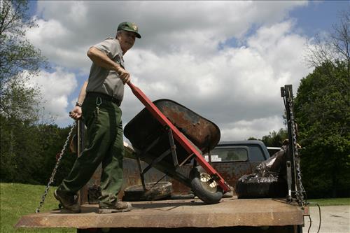 RiverDay trash clean up staff and volunteers at dumpster